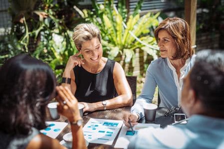 two-female-entrepreneurs-host-meeting-in-casual-setting-thumb