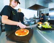 fast food worker prepping food