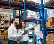 Manager and Supervisor taking inventory in warehouse