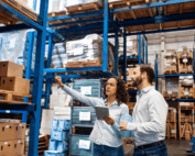 Manager and Supervisor taking inventory in warehouse