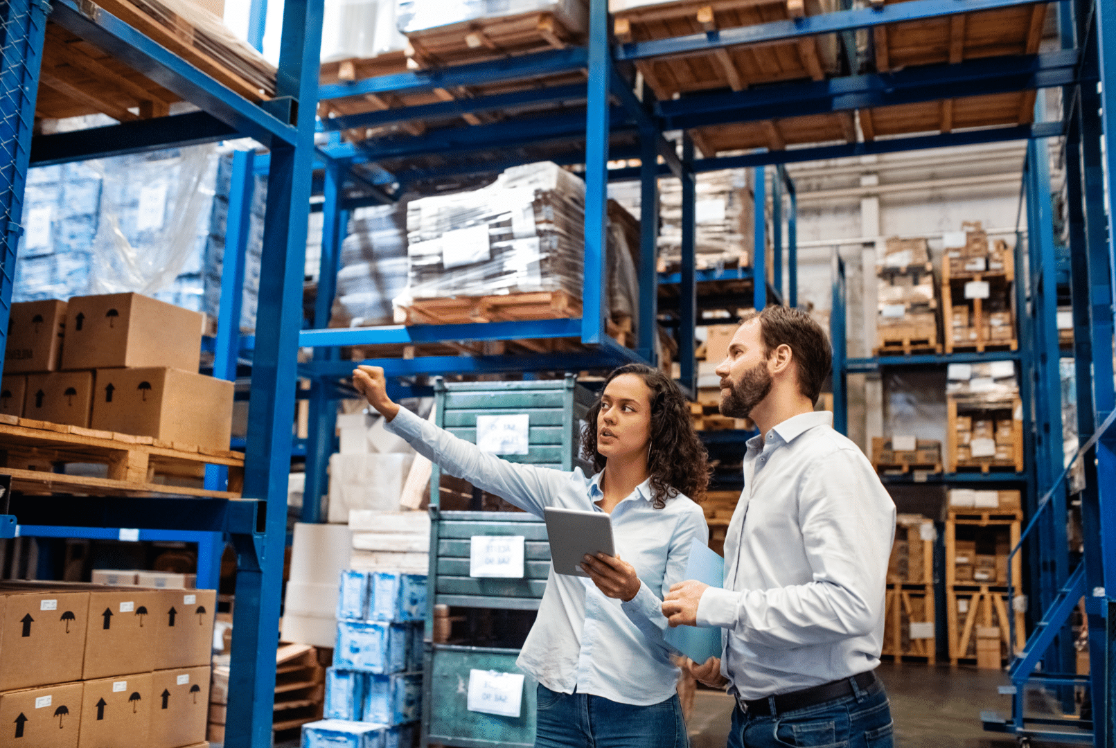 Manager and Supervisor taking inventory in warehouse