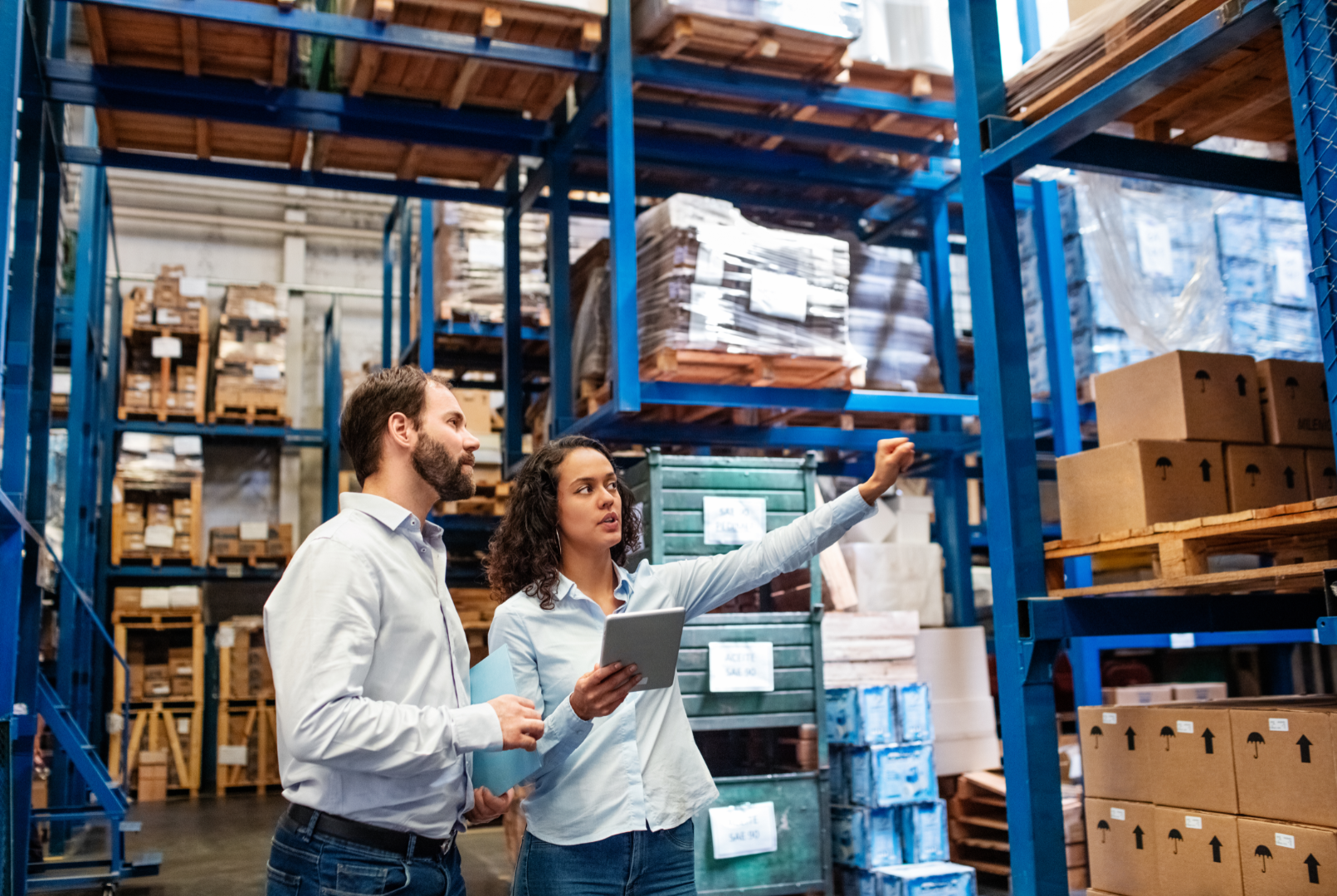 Manager and Supervisor taking inventory in warehouse